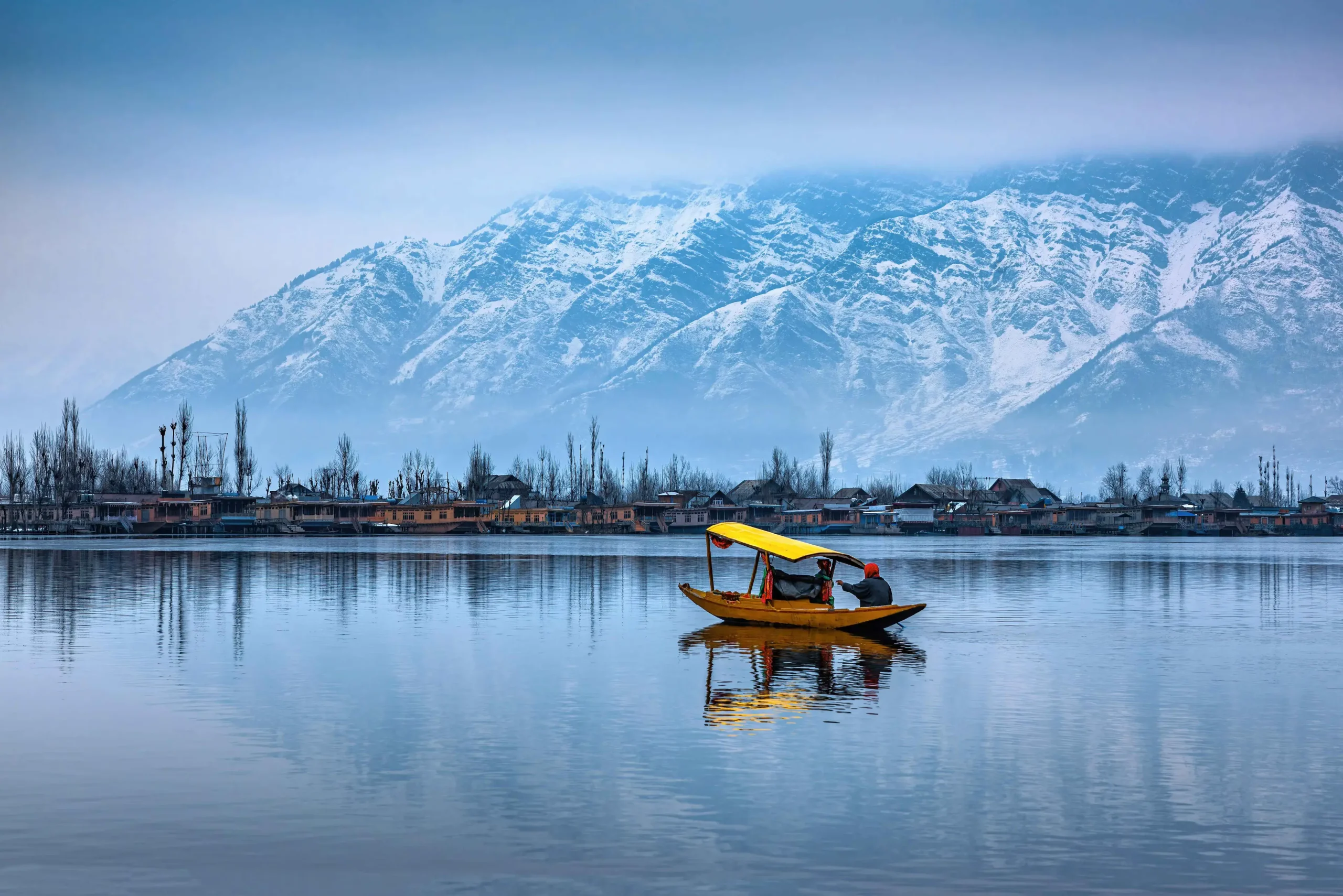 Traditional Colorful Houseboats And Shikaras On Dal Lake, Reflecting Kashmir'S Unique Cultural Heritage.