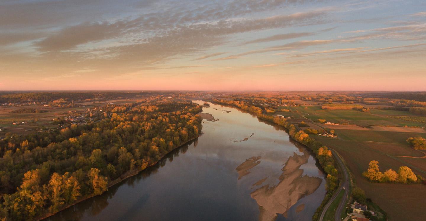 Château De Chenonceau'S Arches Reflecting In The Loire River At Sunset. 