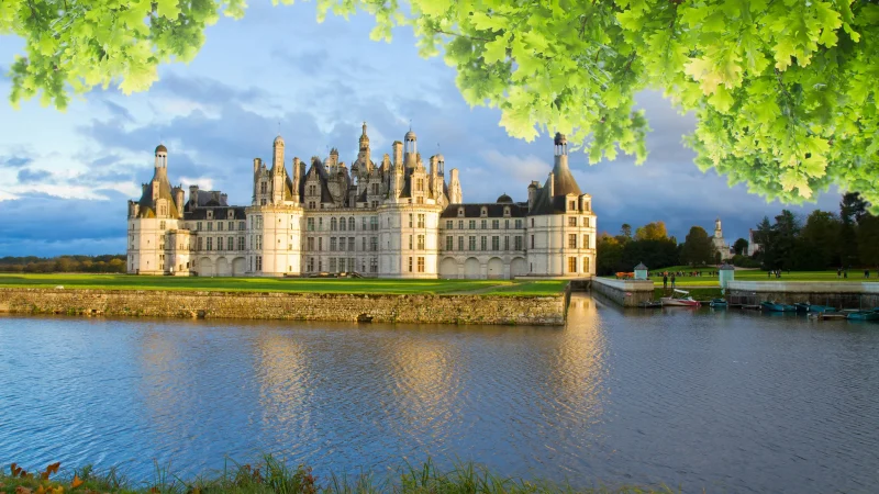 Stunning aerial view of Château de Chambord beside the Loire River.