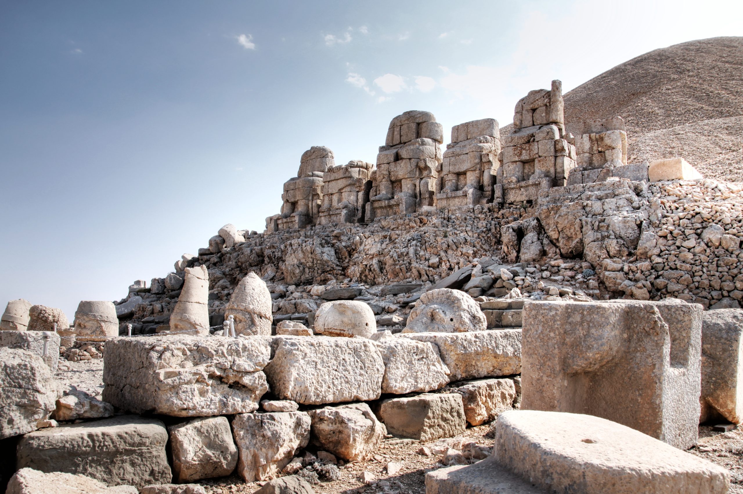 Sunset Over The Statues Of Greek And Persian Gods At Mount Nemrut